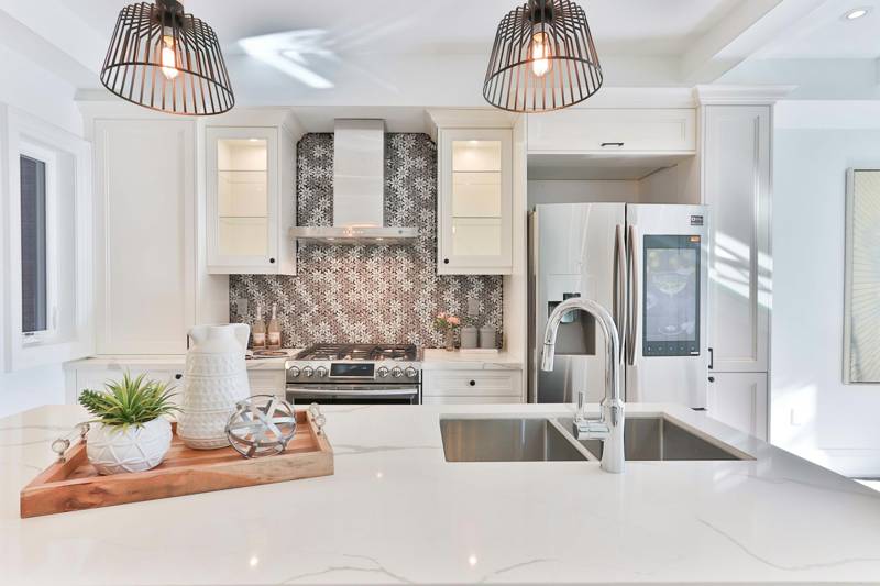 Bright finished kitchen with pendant lights